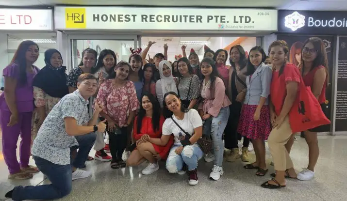 “Group celebration with migrant domestic workers and the Honest Recruiter team in Singapore, showing appreciation and joy together.”