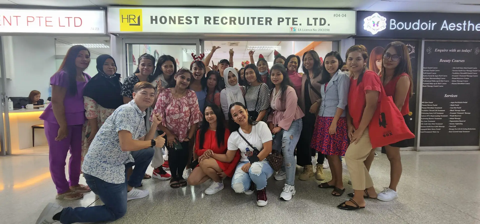 “Group celebration with migrant domestic workers and the Honest Recruiter team in Singapore, showing appreciation and joy together.”